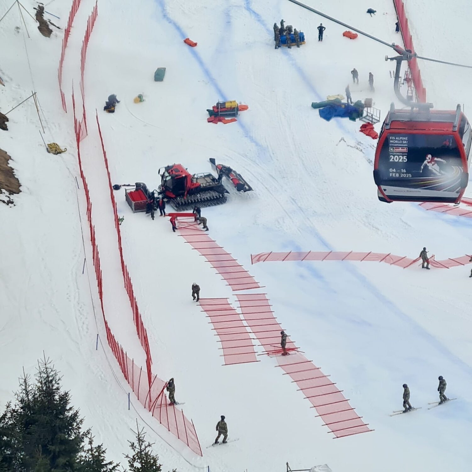 Liski safety fencing and equipment on a ski slope, supporting race preparation and course safety around the world.