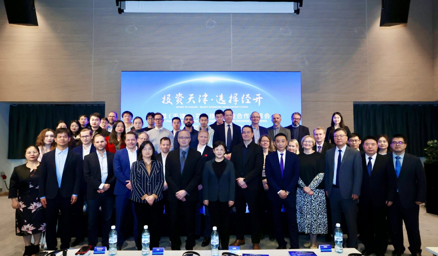 Participants from China and Finland posing for a group photo during the China (Tianjin)–Finland Green Industries Cooperation Exchange Conference in Helsinki