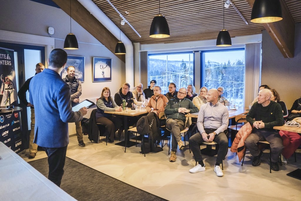 Presentation during the White Winters event in Levi, with participants listening to the speaker.
